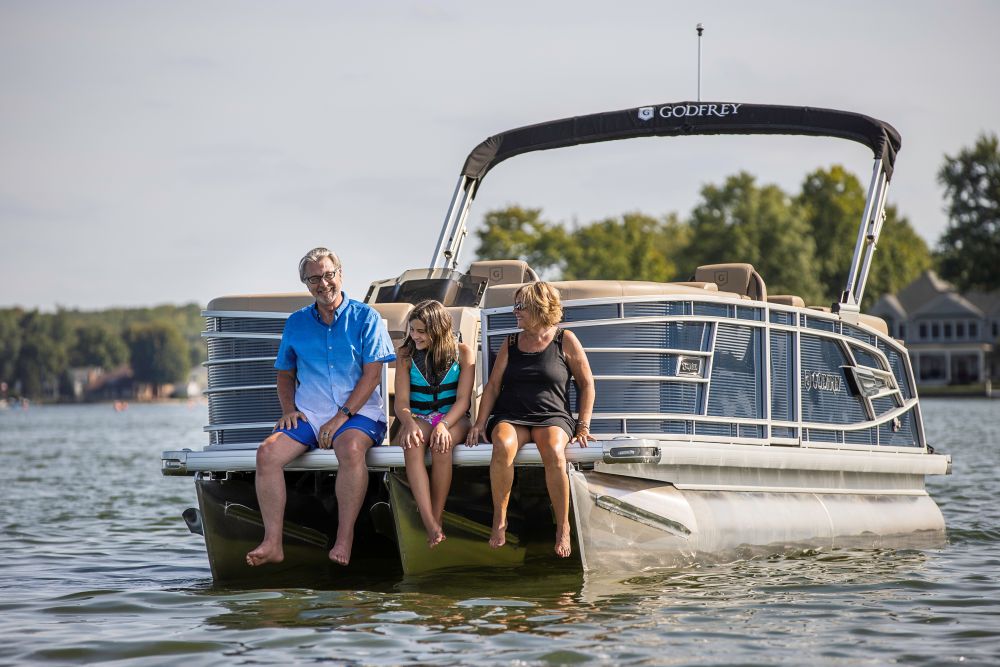 Family enjoying Godfrey pontoon boat rental at Lake Keowee – perfect for relaxing and sightseeing