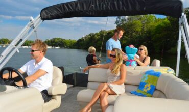 Family enjoying the best boat rental at Lake Keowee with Keowee Marina, relaxing on a yacht by the water.