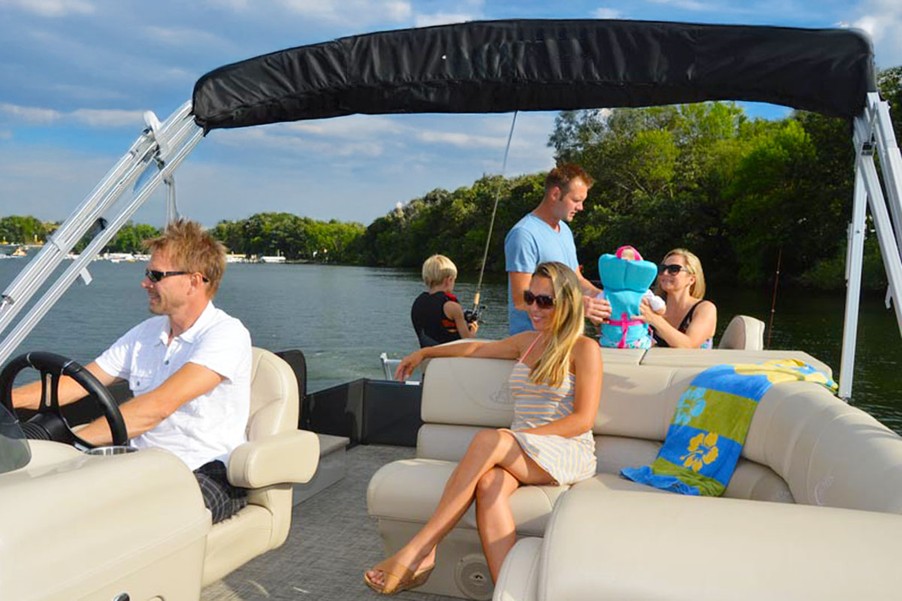 Family enjoying the best boat rental at Lake Keowee with Keowee Marina, relaxing on a yacht by the water.