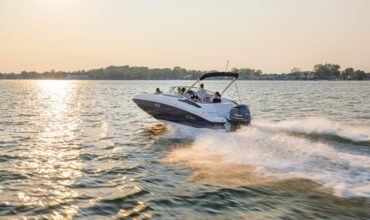 Recreational powerboat cruising on Lake Keowee during spring boating season - Keowee Marina