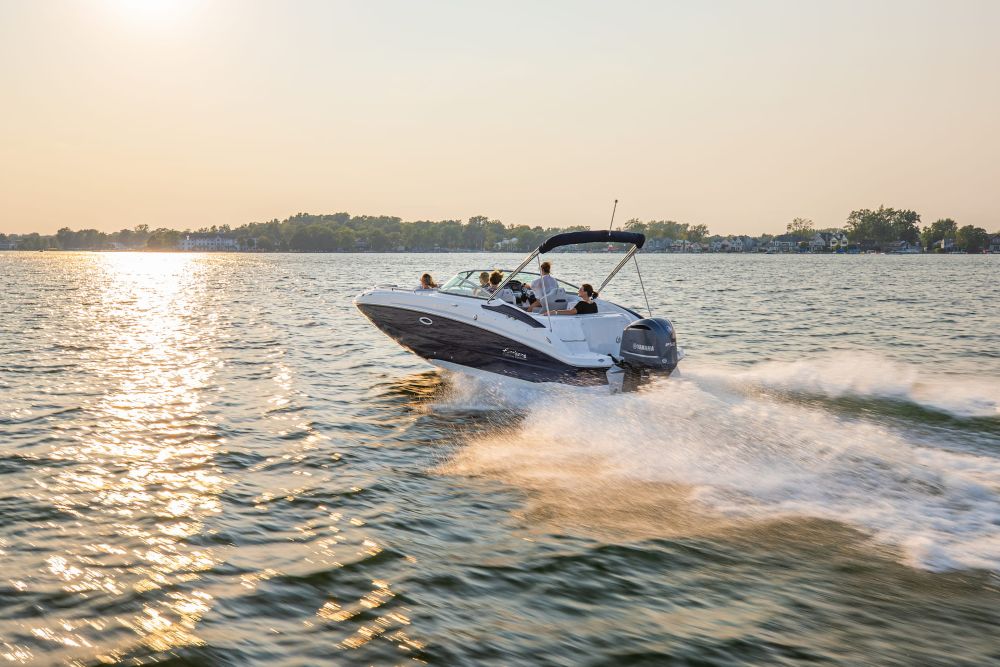 Recreational powerboat cruising on Lake Keowee during spring boating season - Keowee Marina