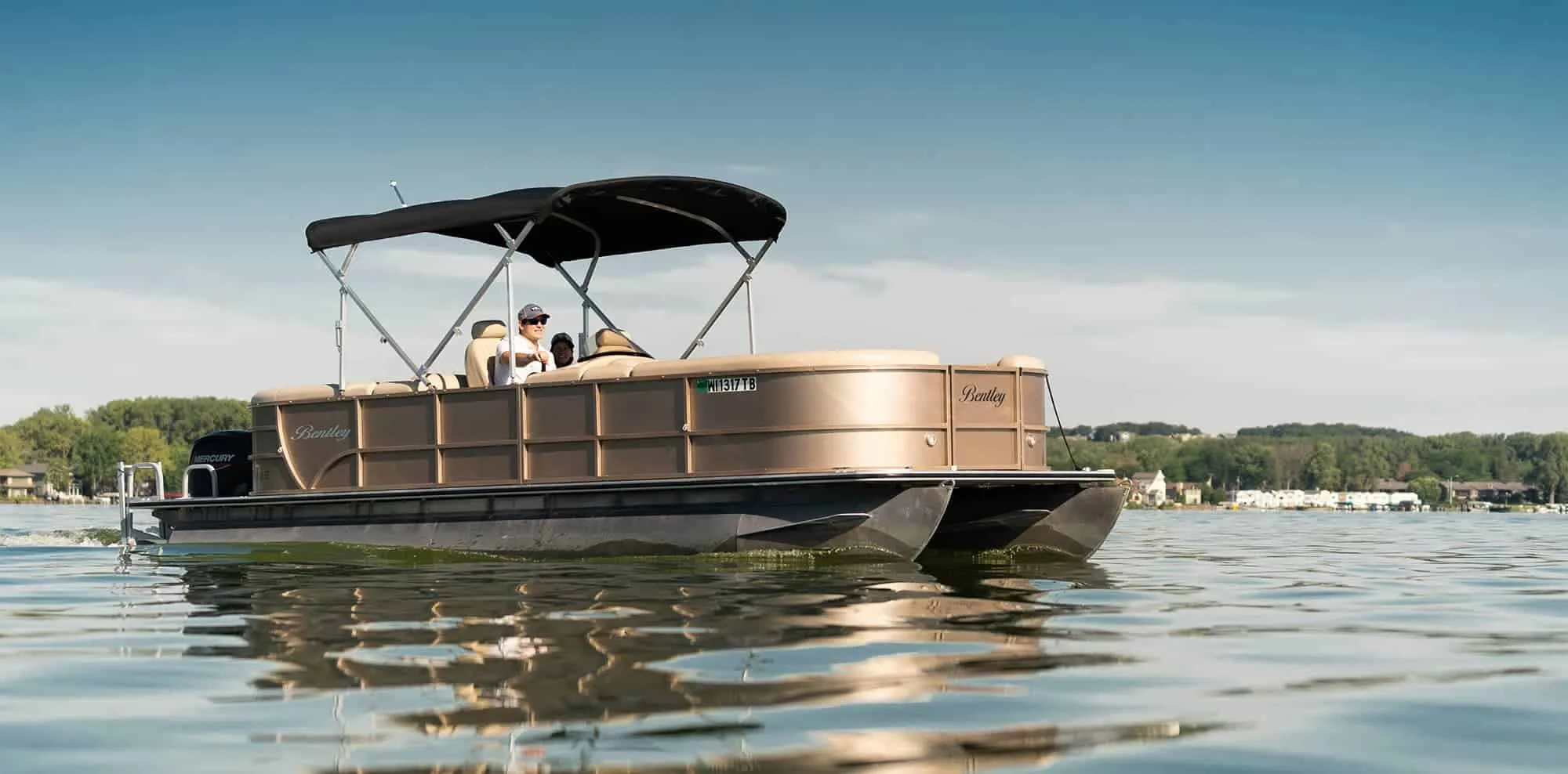 Pontoon boat rental at Lake Keowee with family enjoying calm waters | Keowee Marina