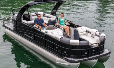 Luxury pontoon boat rental on Lake Keowee with guests relaxing onboard | Keowee Marina