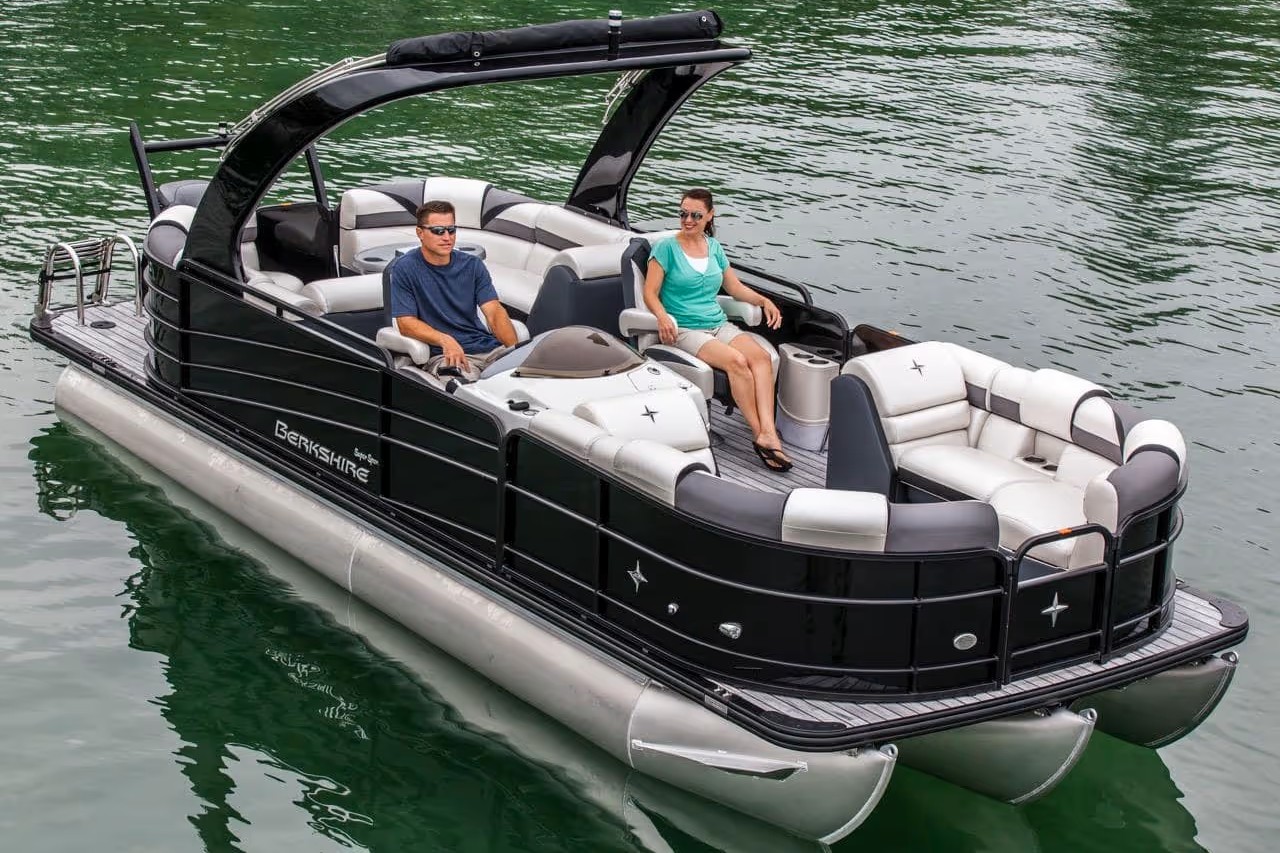 Luxury pontoon boat rental on Lake Keowee with guests relaxing onboard | Keowee Marina
