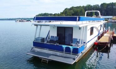 Houseboat at Lake Keowee parked at the shore - Keowee Marina
