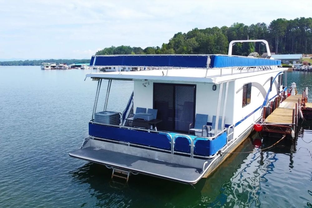 Houseboat at Lake Keowee parked at the shore - Keowee Marina