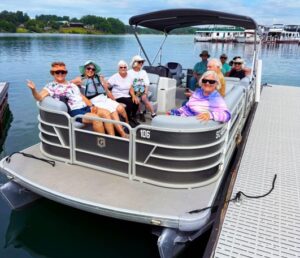 Family enjoying a pontoon boat rental on Lake Keowee at sunset