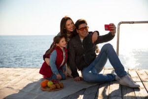 Family clicking photos at Lakeside deck with panoramic views enjoying a calm holiday at Lake Keowee