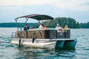 Family enjoying a pontoon boat cruise on Lake Keowee