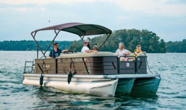 Family enjoying a pontoon boat cruise on Lake Keowee 