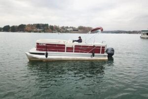 Red pontoon boat rental at Lake Keowee available from Keowee Marina for daily lake trips