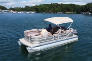 Pontoon boat rental at Lake Keowee from Keowee Marina cruising on clear blue water