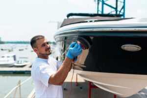 Keowee Marina boat detailing service polishing a boat hull for Lake Keowee boat owners