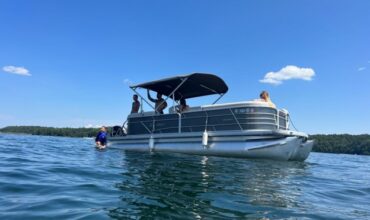 Family spending quality time at Lake Keowee on Tritoon - Keowee Marina