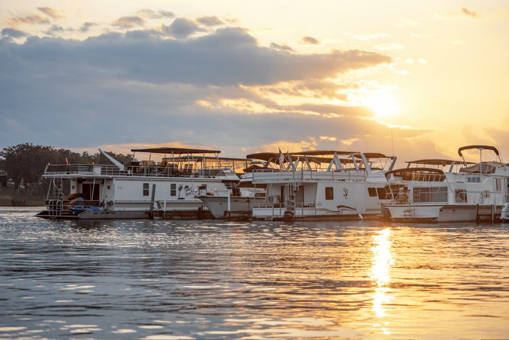 Palmetto Paradise houseboat at sunset on Lake Keowee